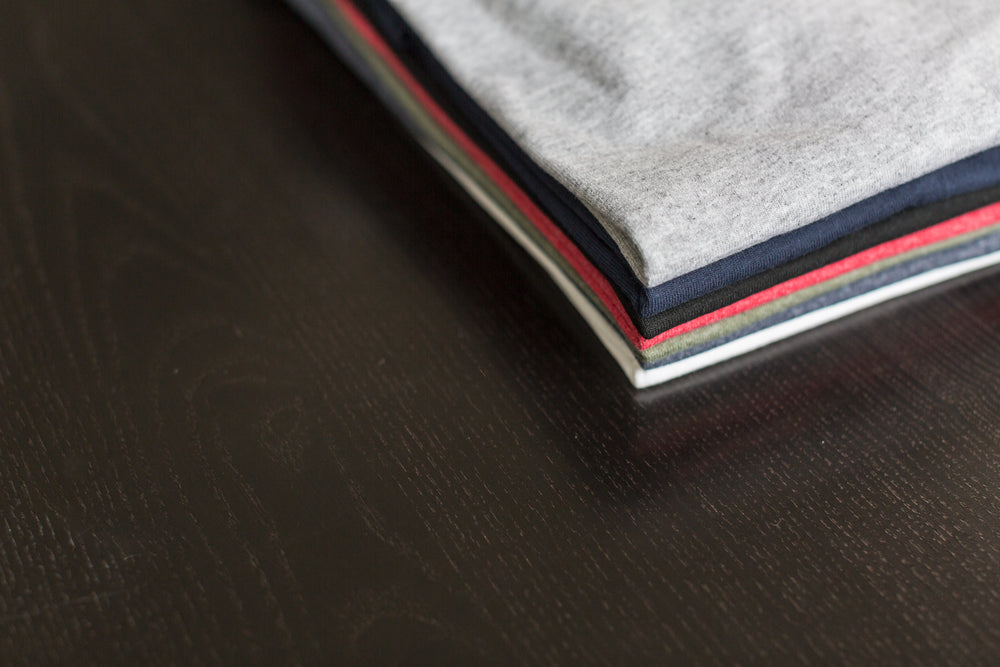 folded tees on table