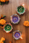 four colorful oil lamps
