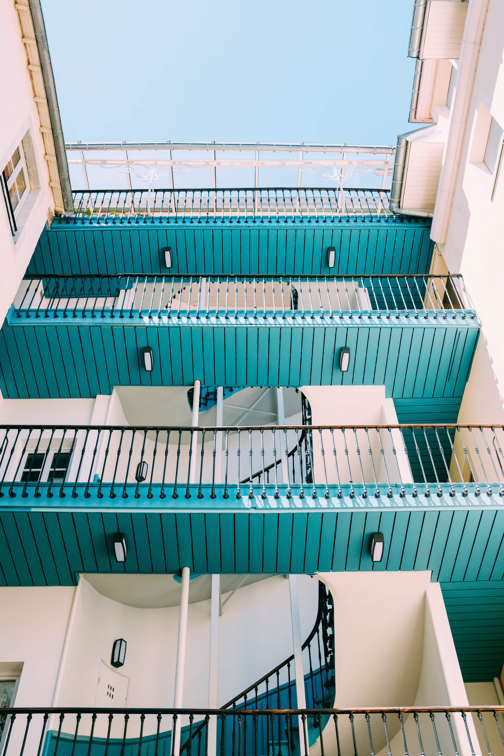 four tiers of wooden walkways in an internal courtyard