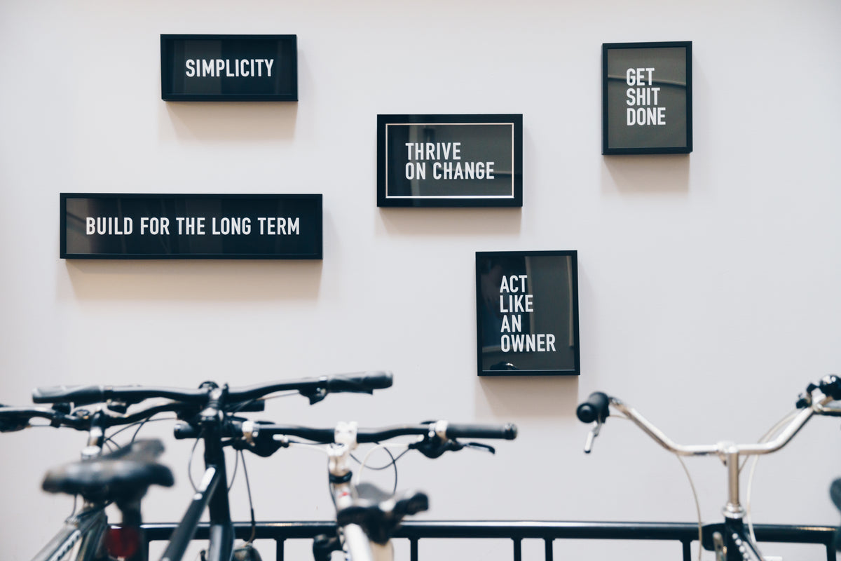 framed quotes behind bike rack