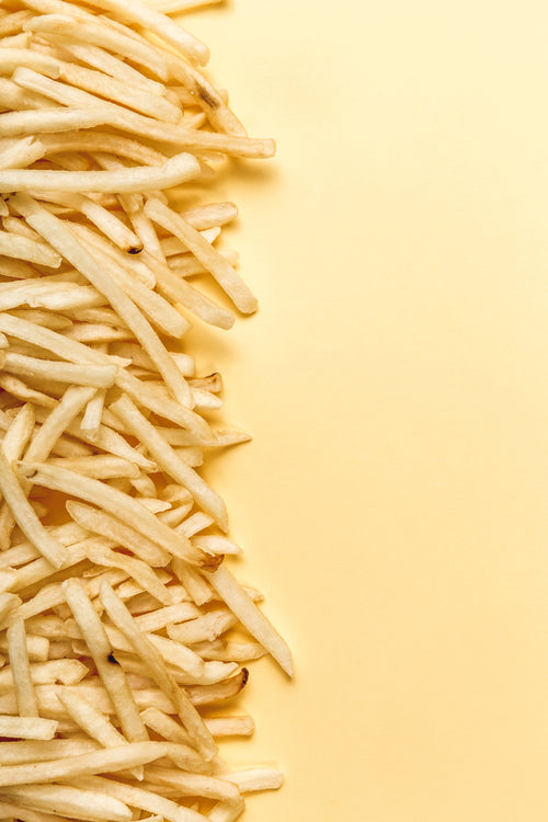 french fries pile on yellow