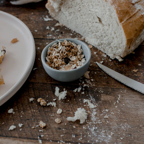 Fresh Baked Bread With Oats On Rustic Table