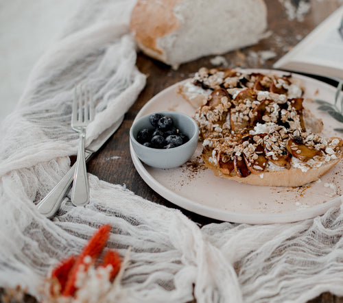 fresh bread covered in fruit and oats