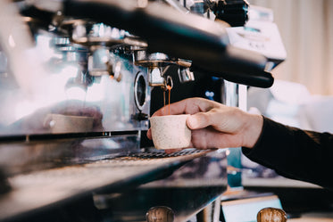 fresh double espresso being made by barista