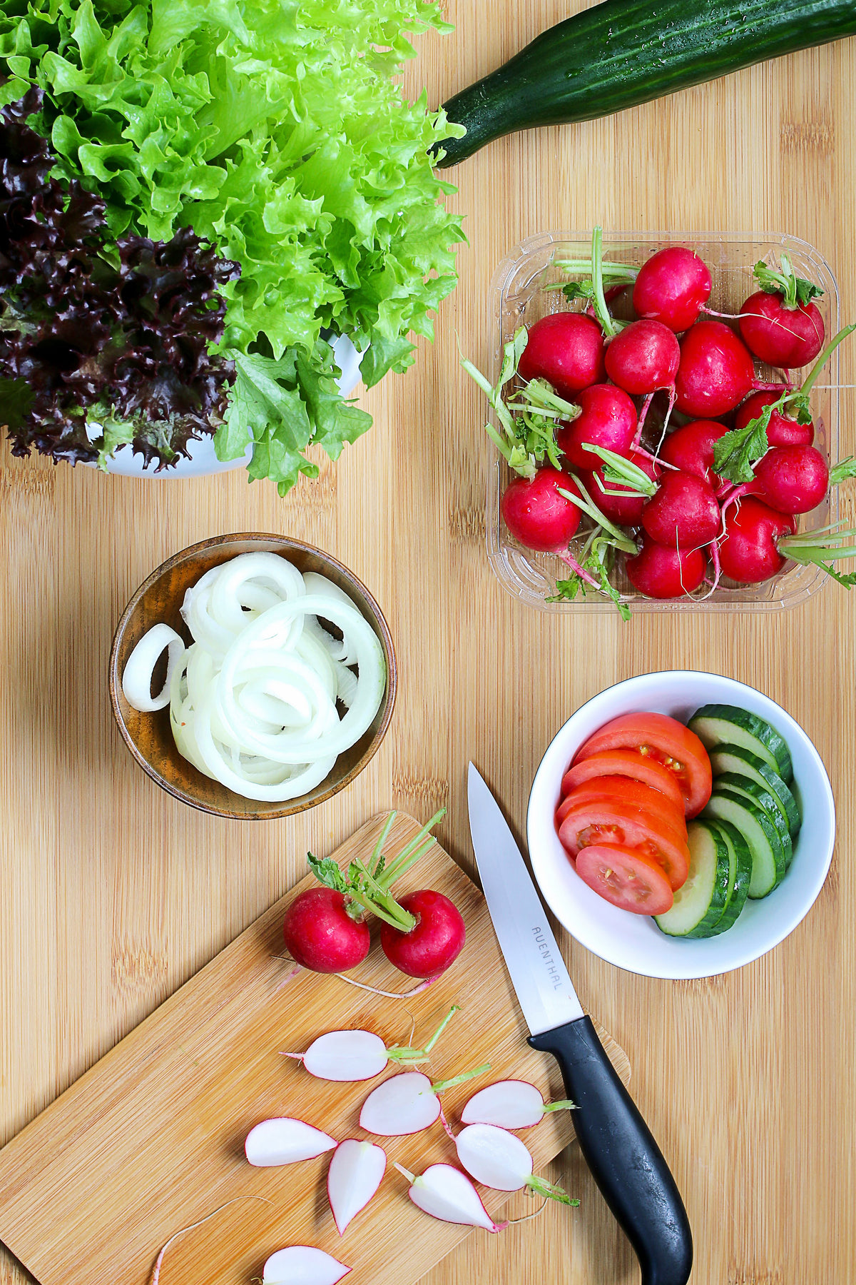 fresh salad ingredients on cutting board