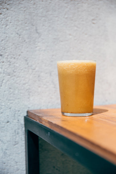 fresh smoothie in glass on table