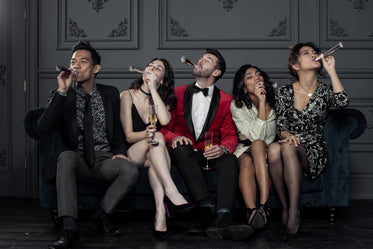 friends celebrate the new year with noisemakers