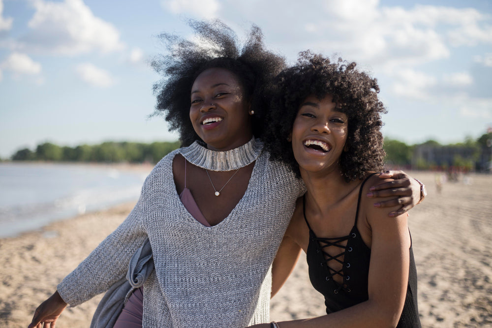 friends laughing on beach