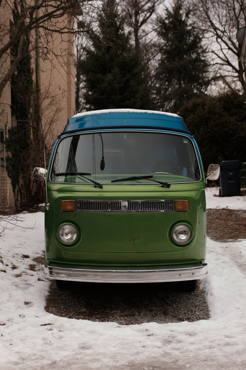 front view of a vintage camper van parked