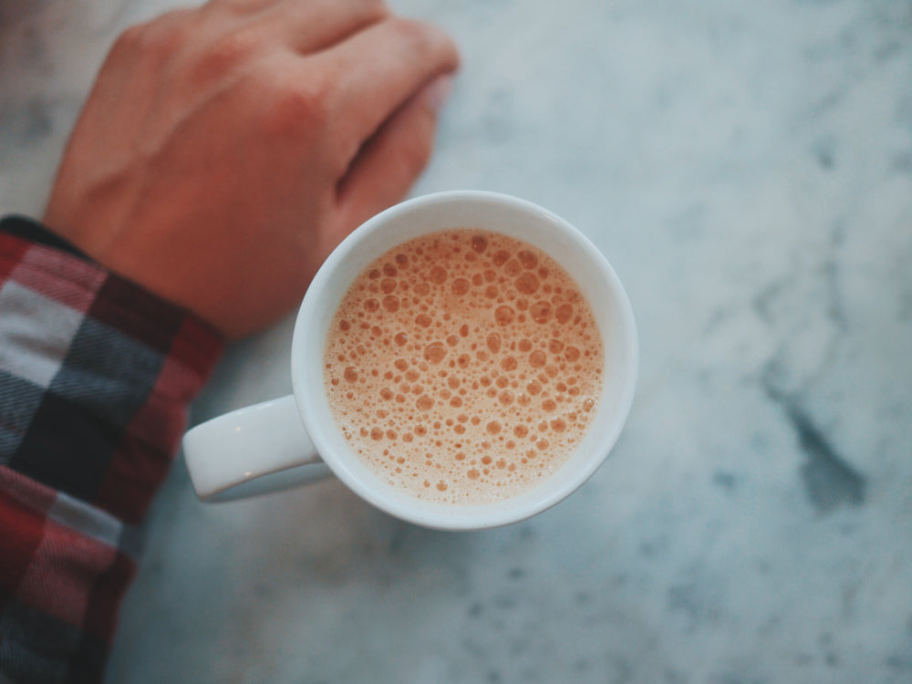 frothy coffee drink in mug