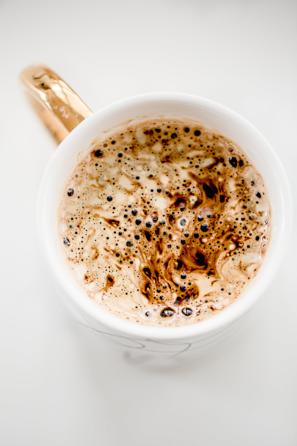 frothy hot chocolate in mug