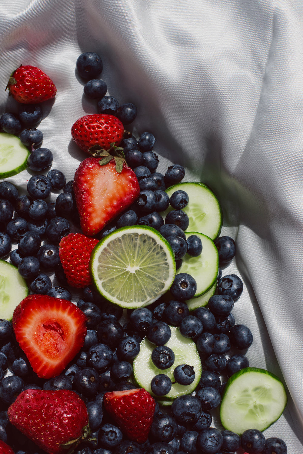 fruits on a white silk fabric