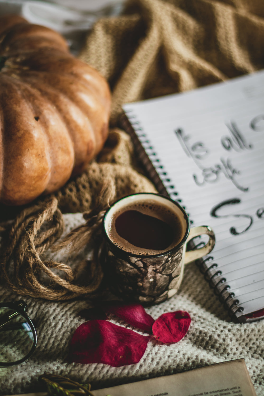 full cup of hot coffee on a brown blanket