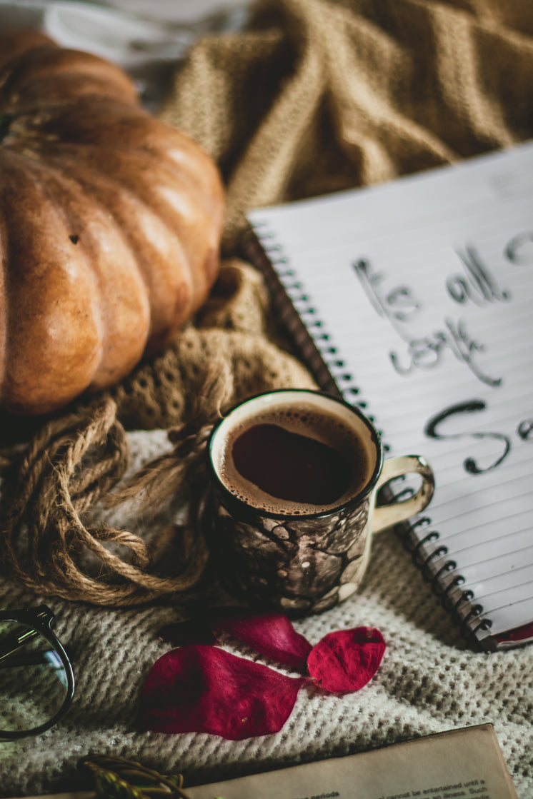 full-cup-of-hot-coffee-on-a-brown-blanke