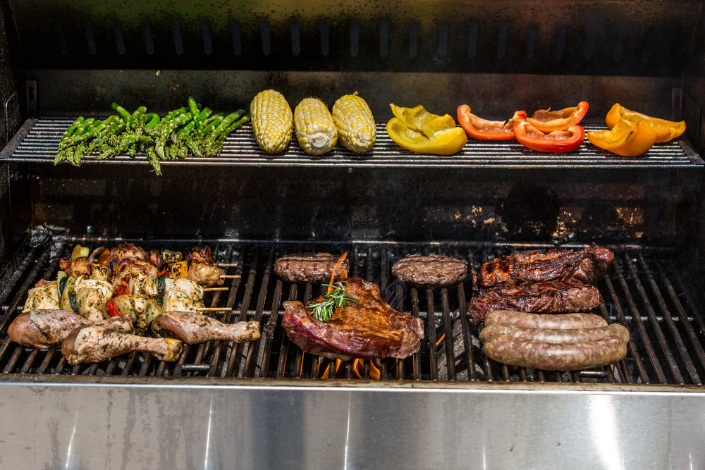 full grill full of meat and veggies