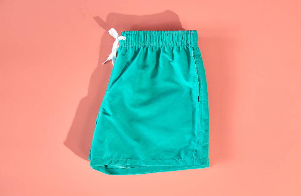 fun teal swim trunks