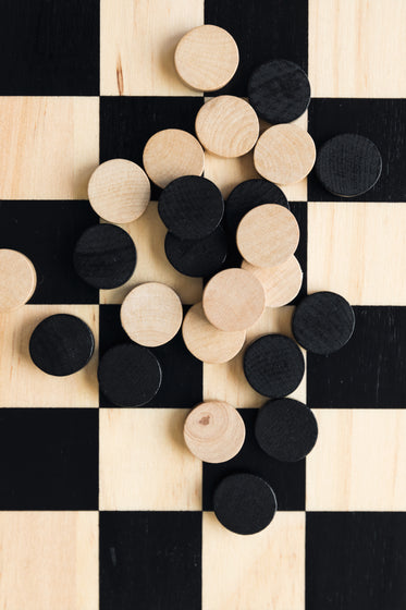 game board with checkers pieces spread out