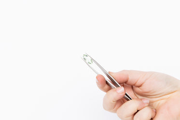 gemstone held in tweezers