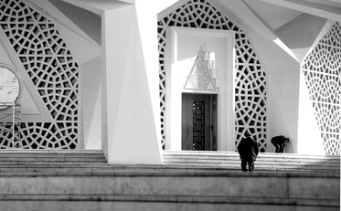 geometric entrance to a large mosque in black and white