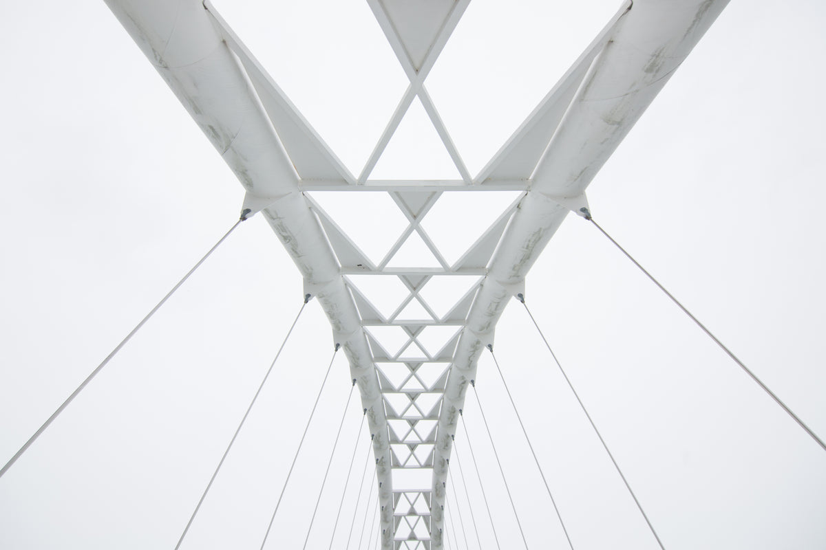 geometric walking bridge white sky