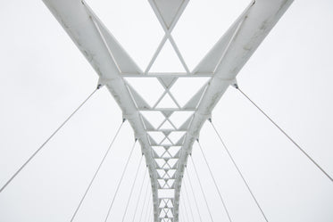geometric walking bridge white sky