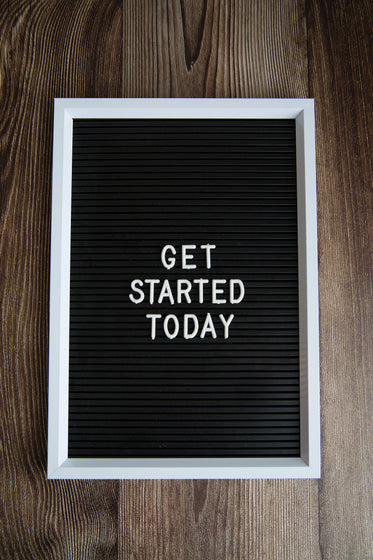 get started today on dark wood background