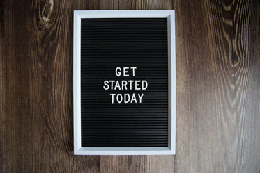 get started today sign on dark wood