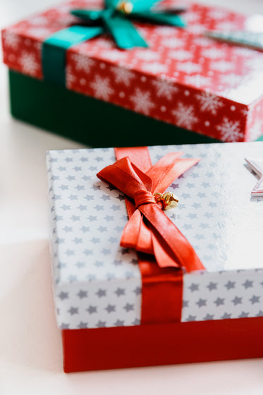 gift wrapped with red and green bows