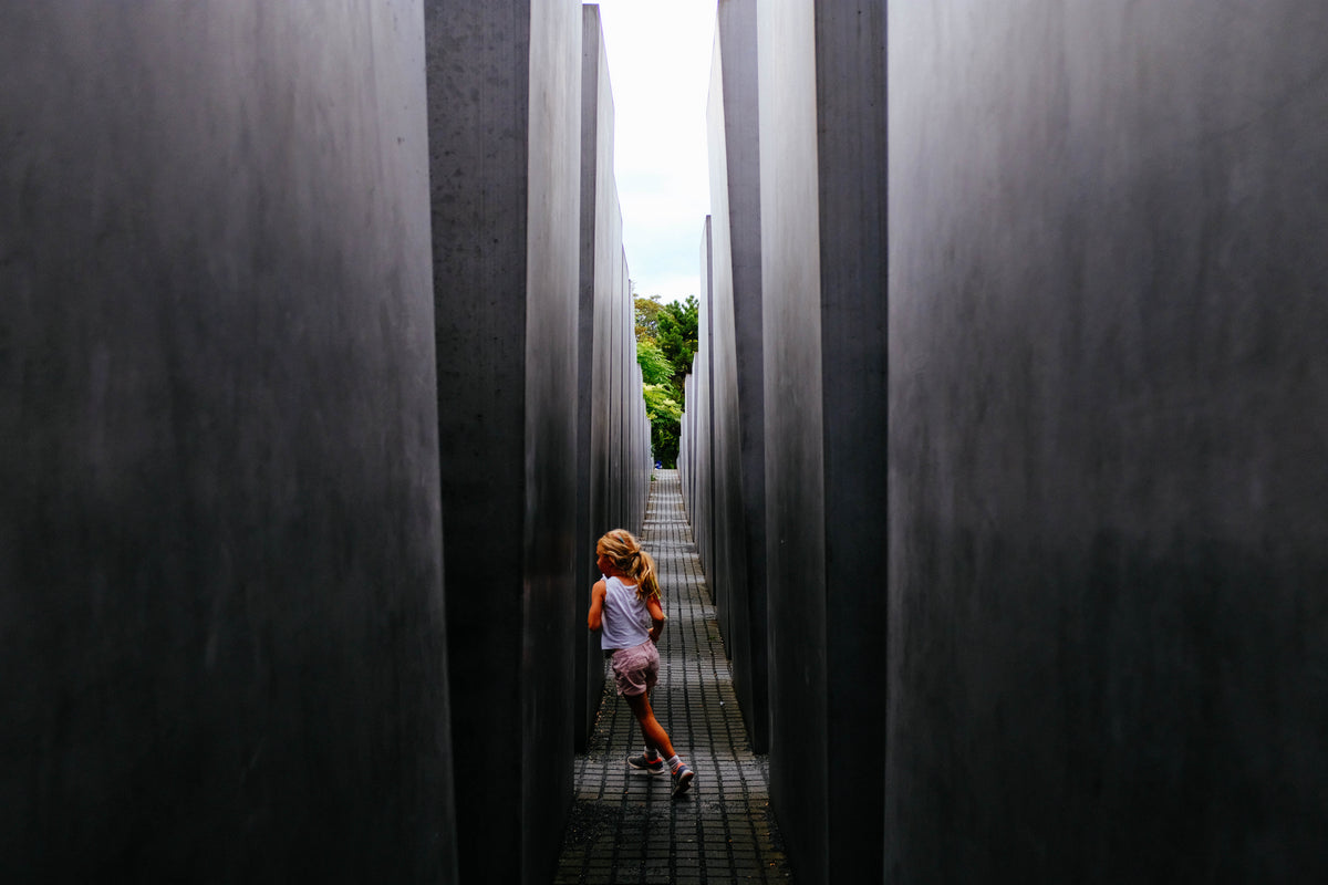 girl plays in concrete structure