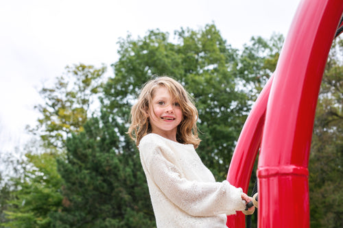 girl smiles on playground
