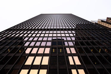 glass building reflecting dusk sky sunset