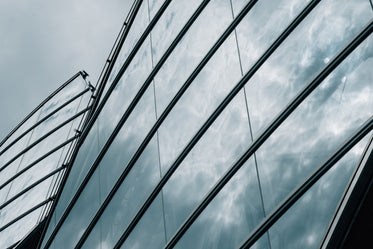 glass building reflecting the clouds above