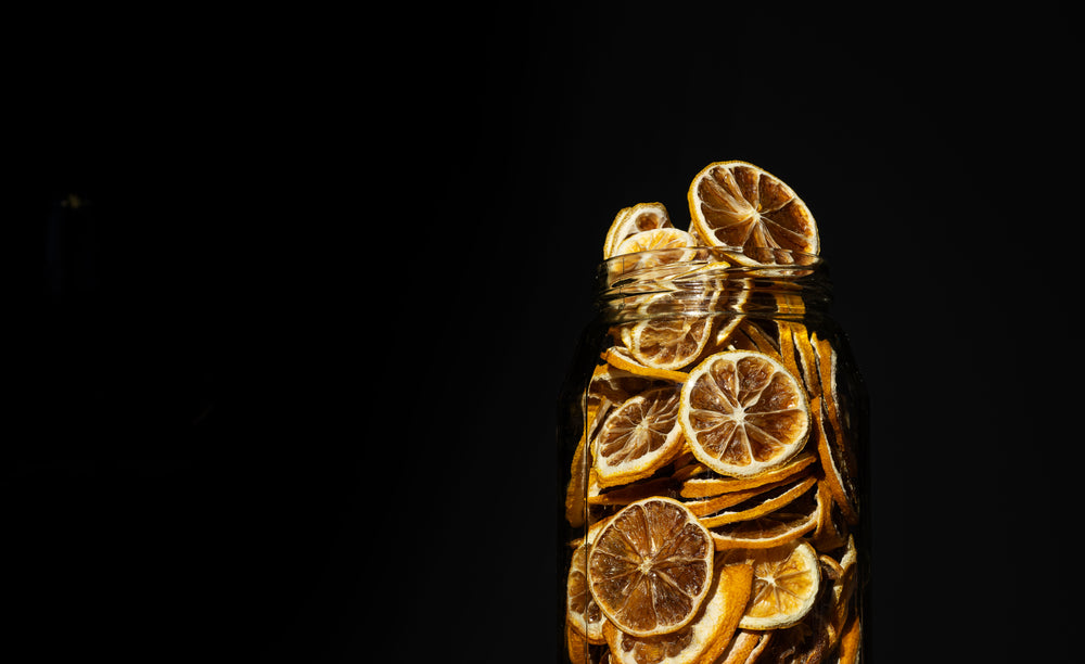 glass jar full of dried lemons