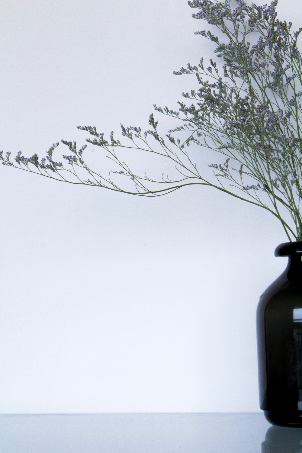 glass vase with purple flower