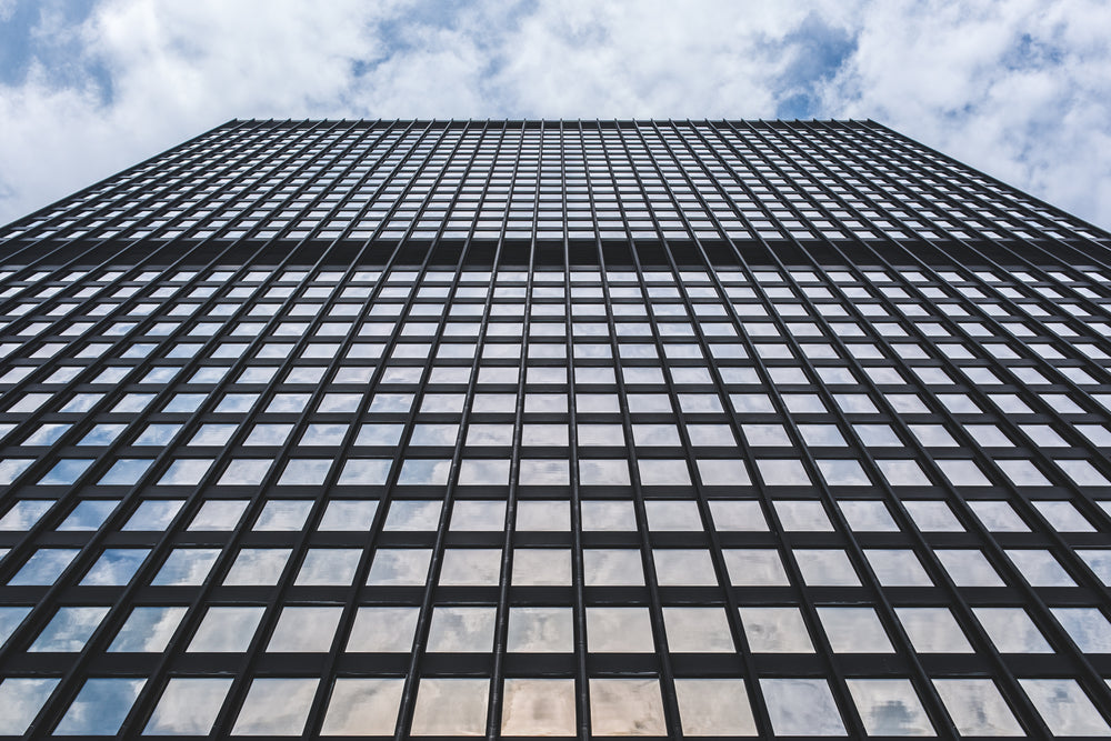 glass windows and blue cloudy sky