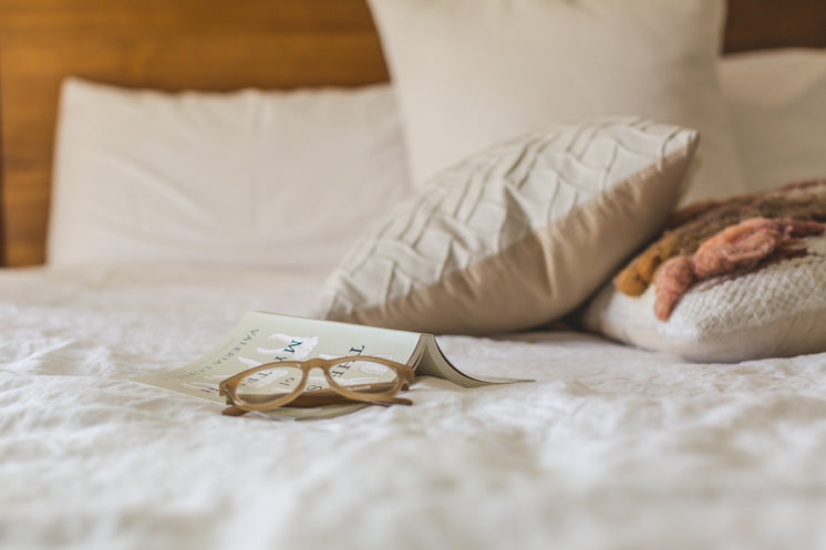 Glasses On Made Bed