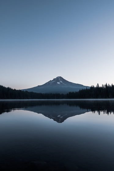 glassy lake reflects mount hood oregon