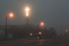 glowing cross through fog