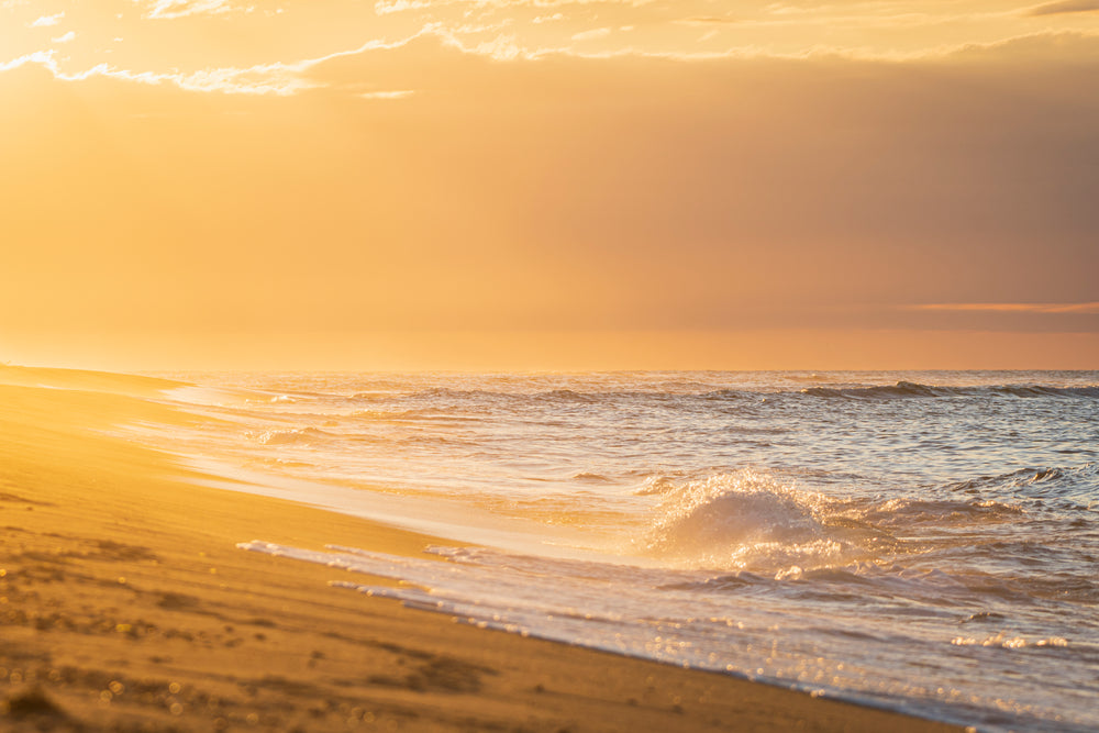 glowing orange sunset on a beach