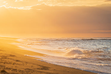 glowing orange sunset on a beach