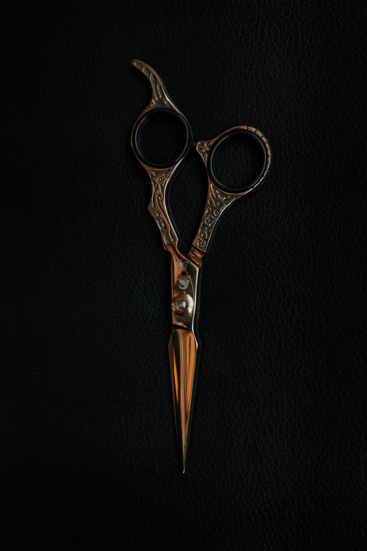 Gold Scissors Against Black