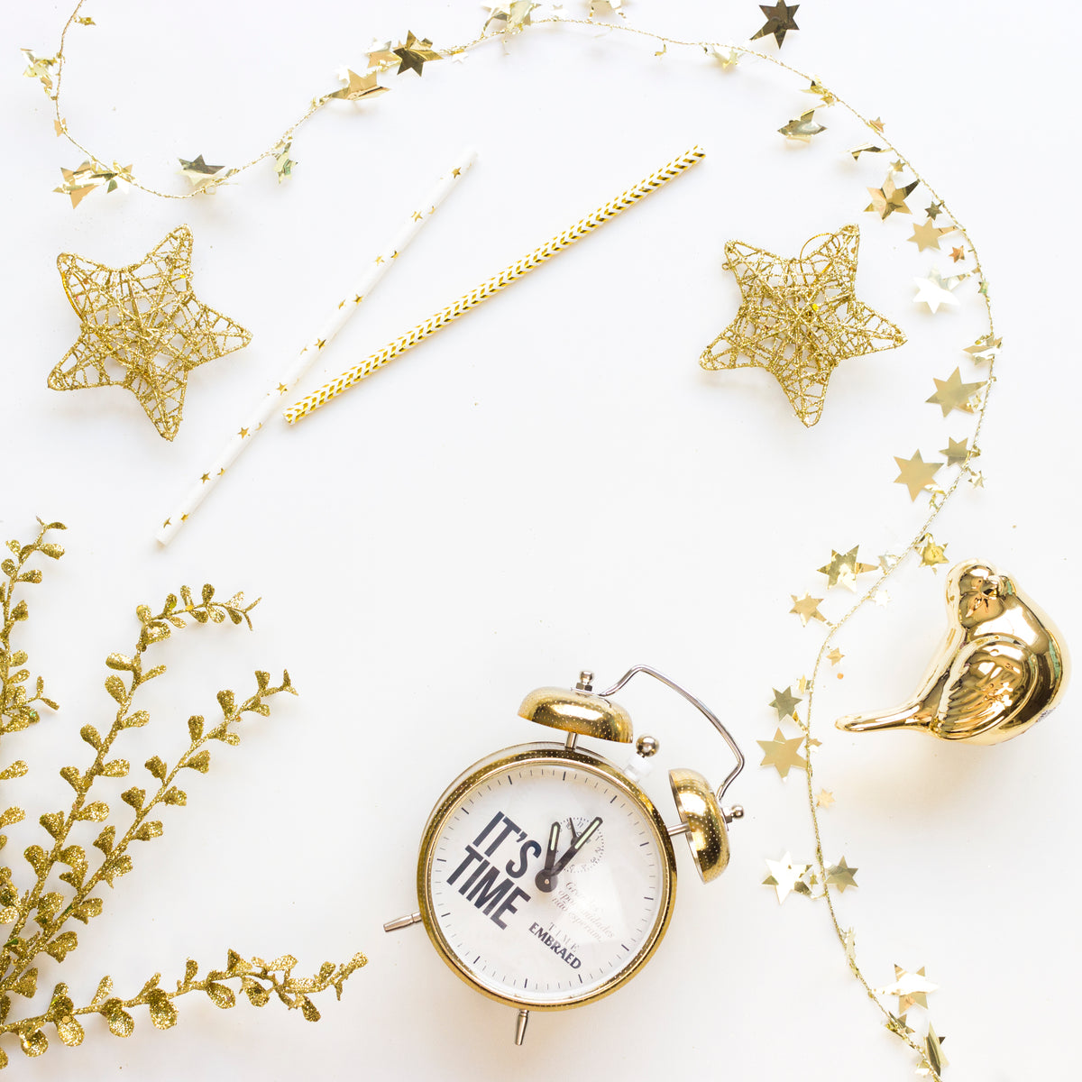 gold wire-frame stars, christmas decorations, and a clock.
