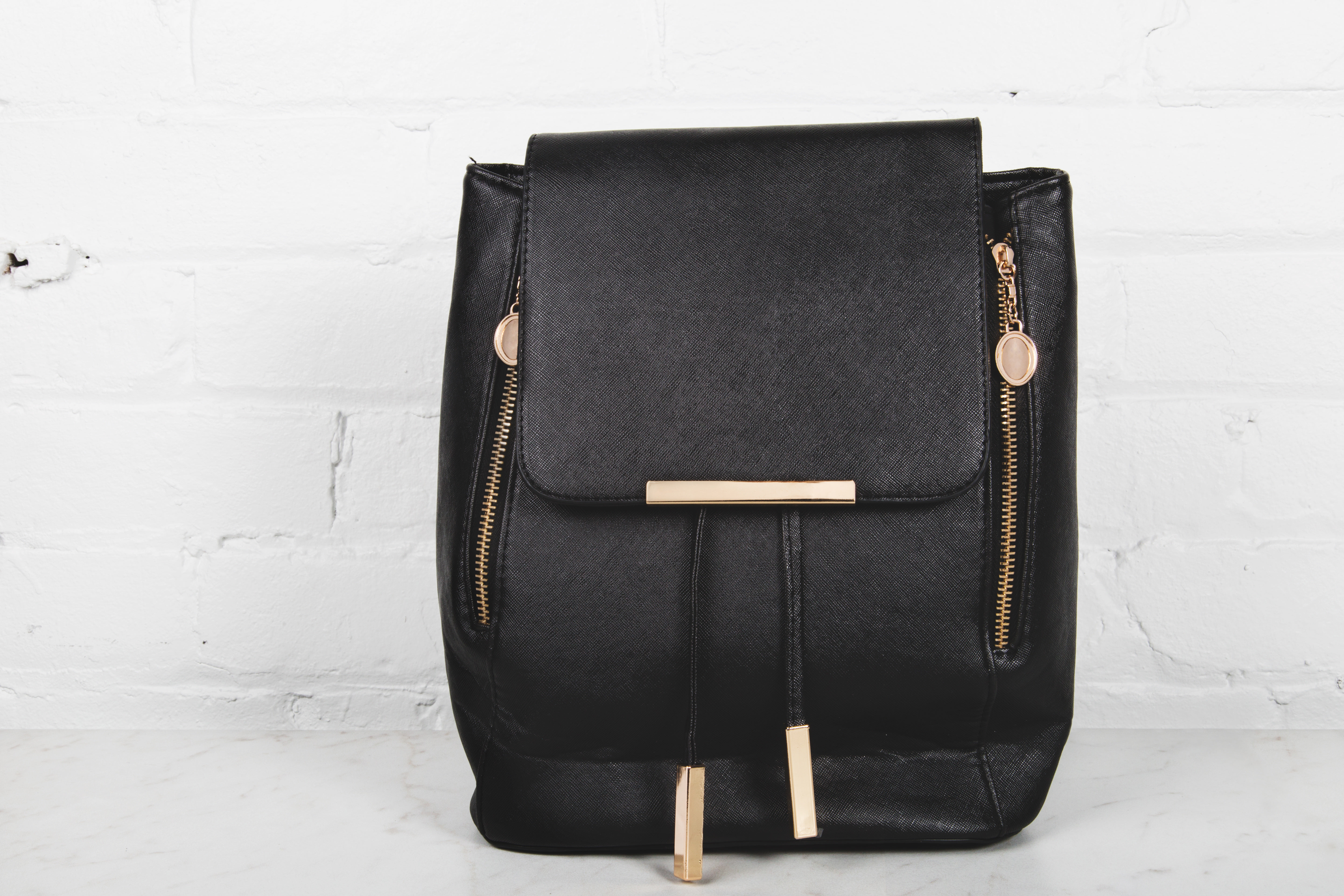 Black backpack discount with gold zippers