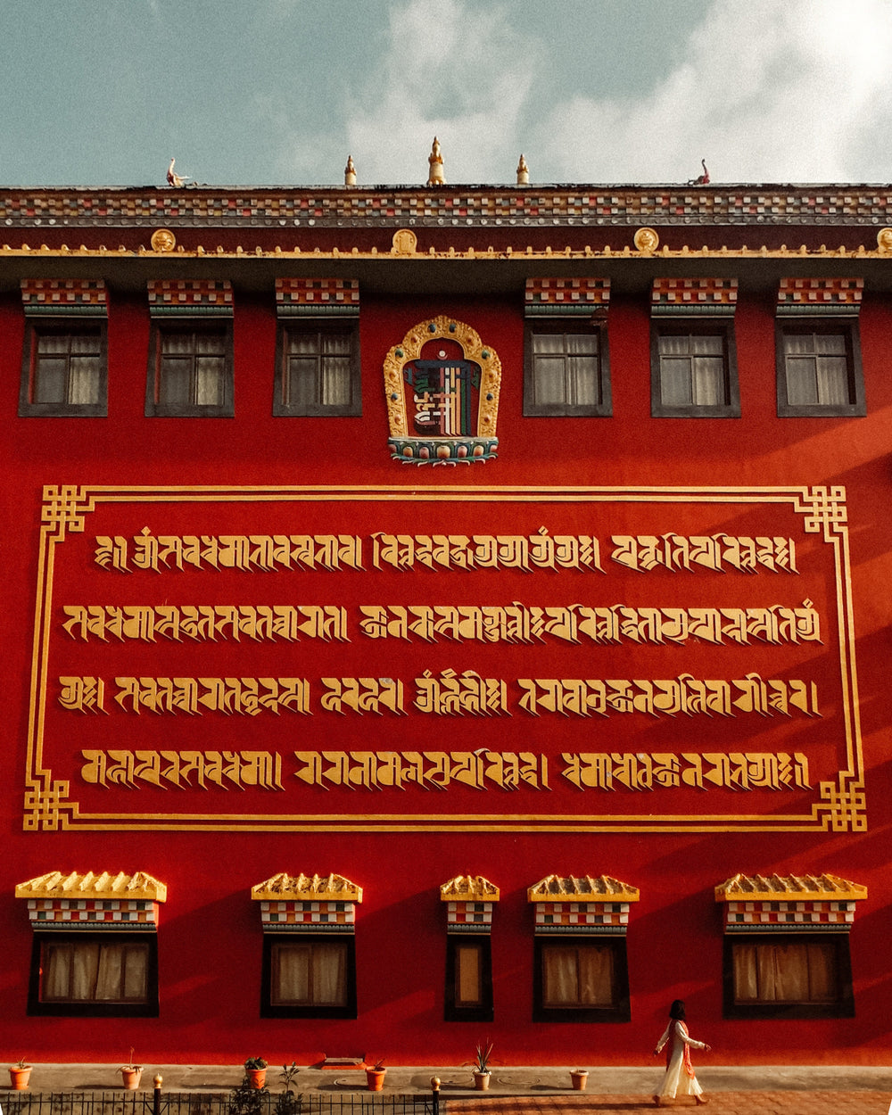 golden lettering on a red temple