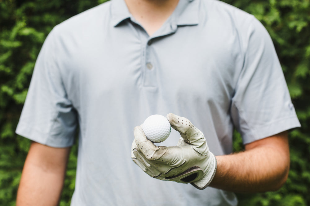 golf ball in hand