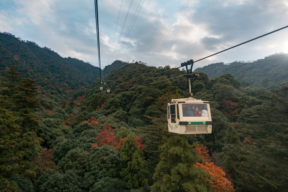 gondola reaches over colorful fall trees