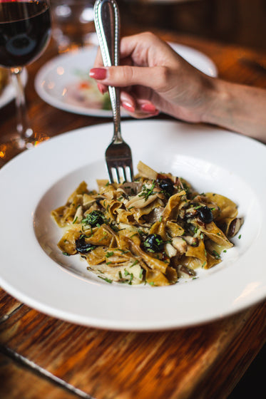 gourmet pasta in white bowl