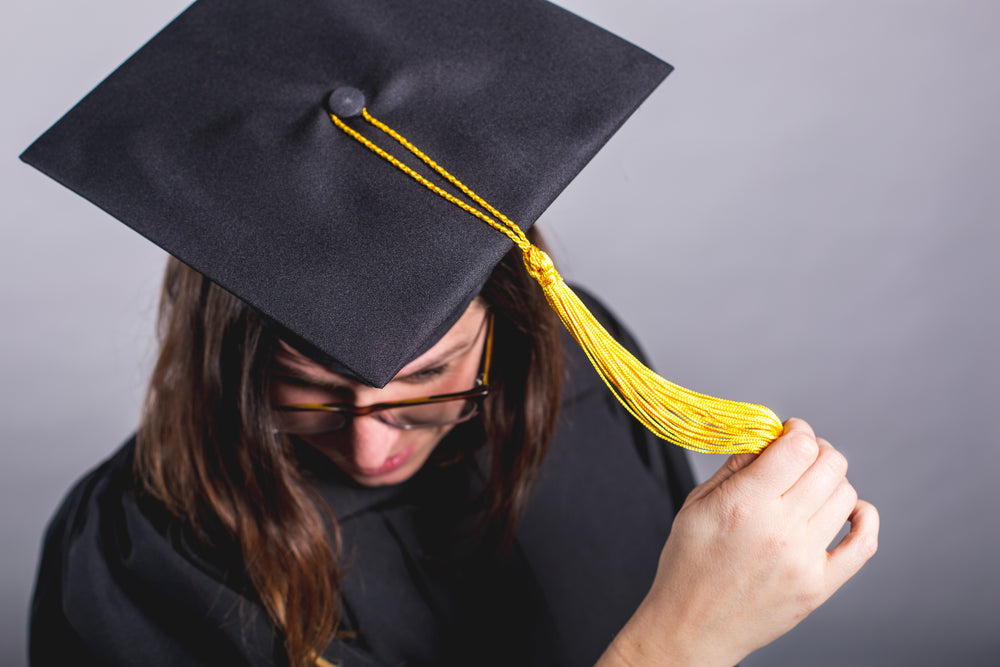 grad student moving tassle over