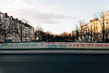 graffiti sprayed on a bridge over a canal