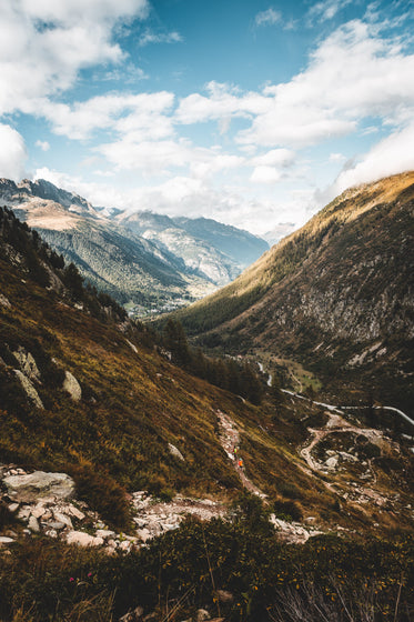 green and brown mountains creating a deep valley